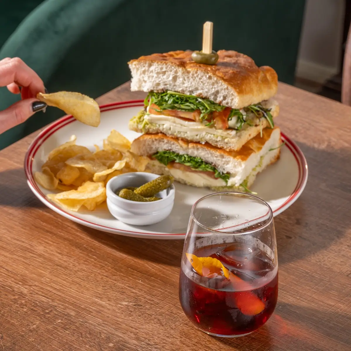 Panini plate with chips and a spritz at Gemelli Coffee and Panini