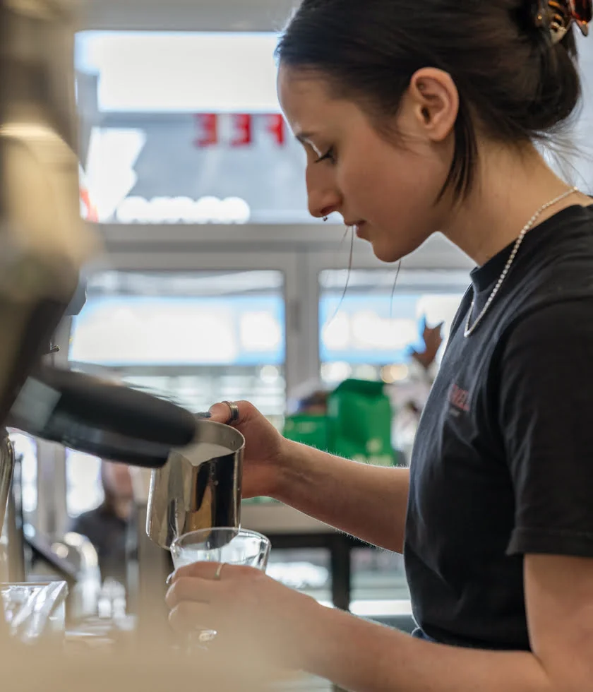Liana pouring a latte at Gemelli